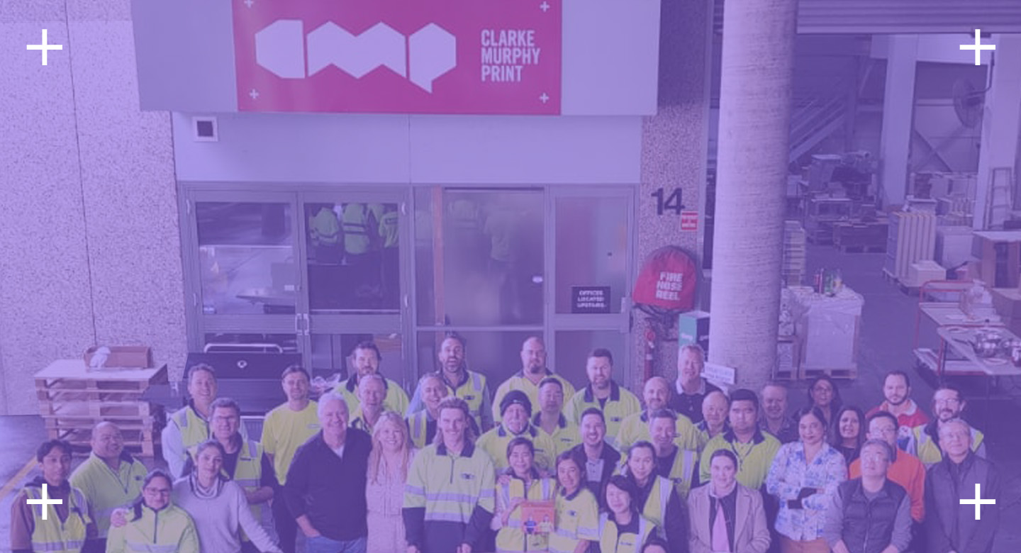 CMP Team photo with the company sign behind